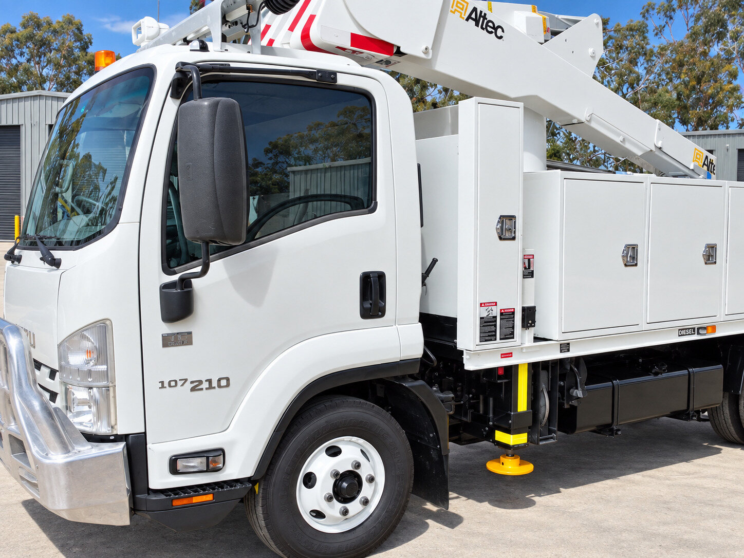 Isuzu Altec AT37G EWP truck side view with boom and equipment body